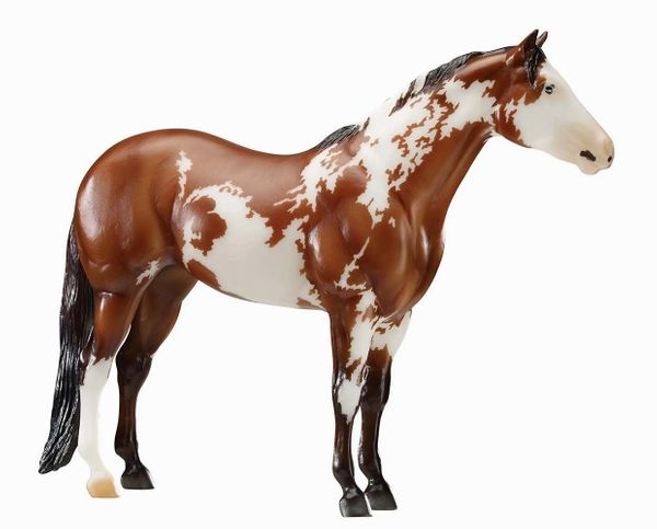 A brown and white spotted horse figurine